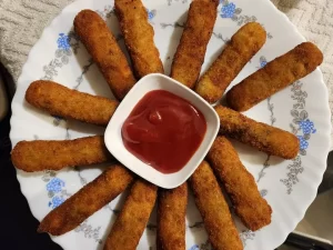 Chicken fingers are finger shaped chicken that are marinated, dipped in the bread crumbs and finally fried in oil. 