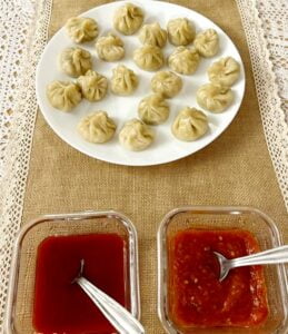 Chicken momos are actually steamed chicken dumplings. Here, minced chicken are flavored with vegetables, soy sauce and other ingredients to make a filling. This filling is then stuffed inside a thin flour dough and is then cooked by steaming. 