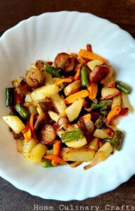 This is a one pan recipe where the sausages are sliced and mixed with veggies, and stir fried in oil. You can add your favourite vegetables in this recipe. You may include mushrooms, broccoli, cauliflower etc. which can add extra flavor to this recipe. 