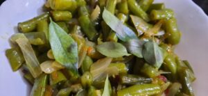 The Beans Mezhukkupuratti Recipe is a simple stir fry of beans along with onion and curry leaves.