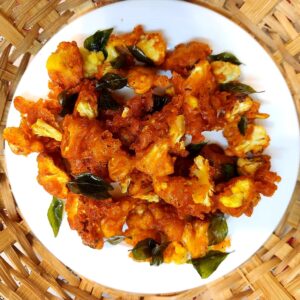 Gobi 65 is a popular and mouthwatering Indian snack or appetizer that is loved by people of all ages. It is a vegetarian dish made from cauliflower florets that are marinated in a flavorful blend of spices, coated with a crispy batter, and deep-fried to perfection. 