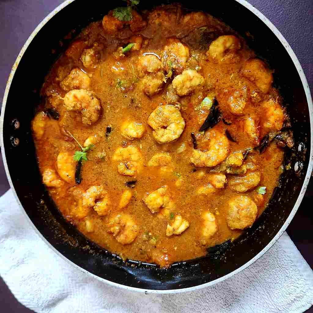 Chettinad Prawns Curry is a celebrated dish hailing from the Chettinad region of Tamil Nadu, South India. At the heart of Chettinad Prawns Curry are succulent prawns, freshly caught and marinated with a mixture of red chili powder, turmeric, and salt. 